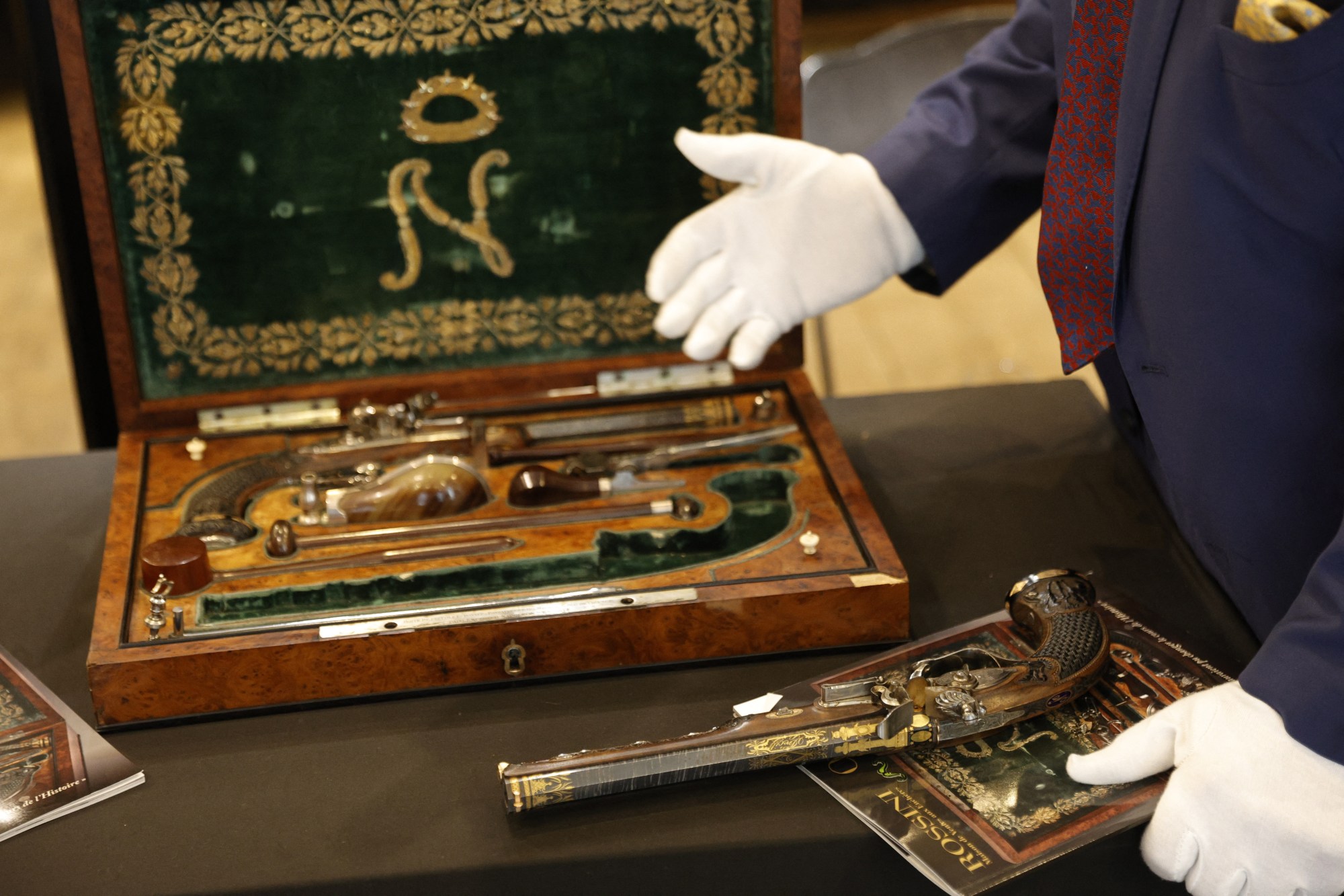This photograph shows a box containing two pistols, which belonged to Emperor Napoleon I, during the preview before their auction, in Paris on June 18, 2024. The sale «L'Empire à Fontainebleau», organised by both Rossini and Osenat auction houses, will take place on July 7, 2024 in Fontainebleau. (Photo by Geoffroy VAN DER HASSELT / AFP) (Photo by GEOFFROY VAN DER HASSELT/AFP via Getty Images)