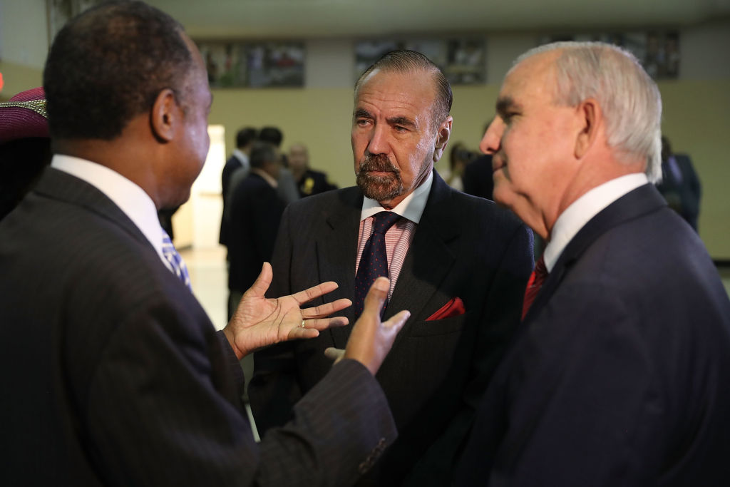 MIAMI, FL - APRIL 12:  Jorge Perez, CEO, Related Urban Group and Carlos Gimenez, mayor of Miami-Dade, (L-R) speak with U.S. Housing and Urban Development Secretary Ben Carson during a visit to the Liberty Square apartment complex on April 12, 2017 in Miami, Florida. Secretary Carson is on a national listening tour to hear from the people and organizations who rely on and support public housing.  (Photo by Joe Raedle/Getty Images)